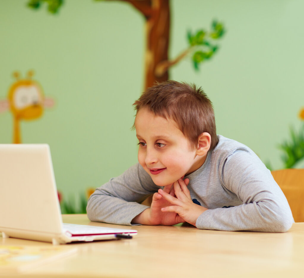 boy watching content on a laptop