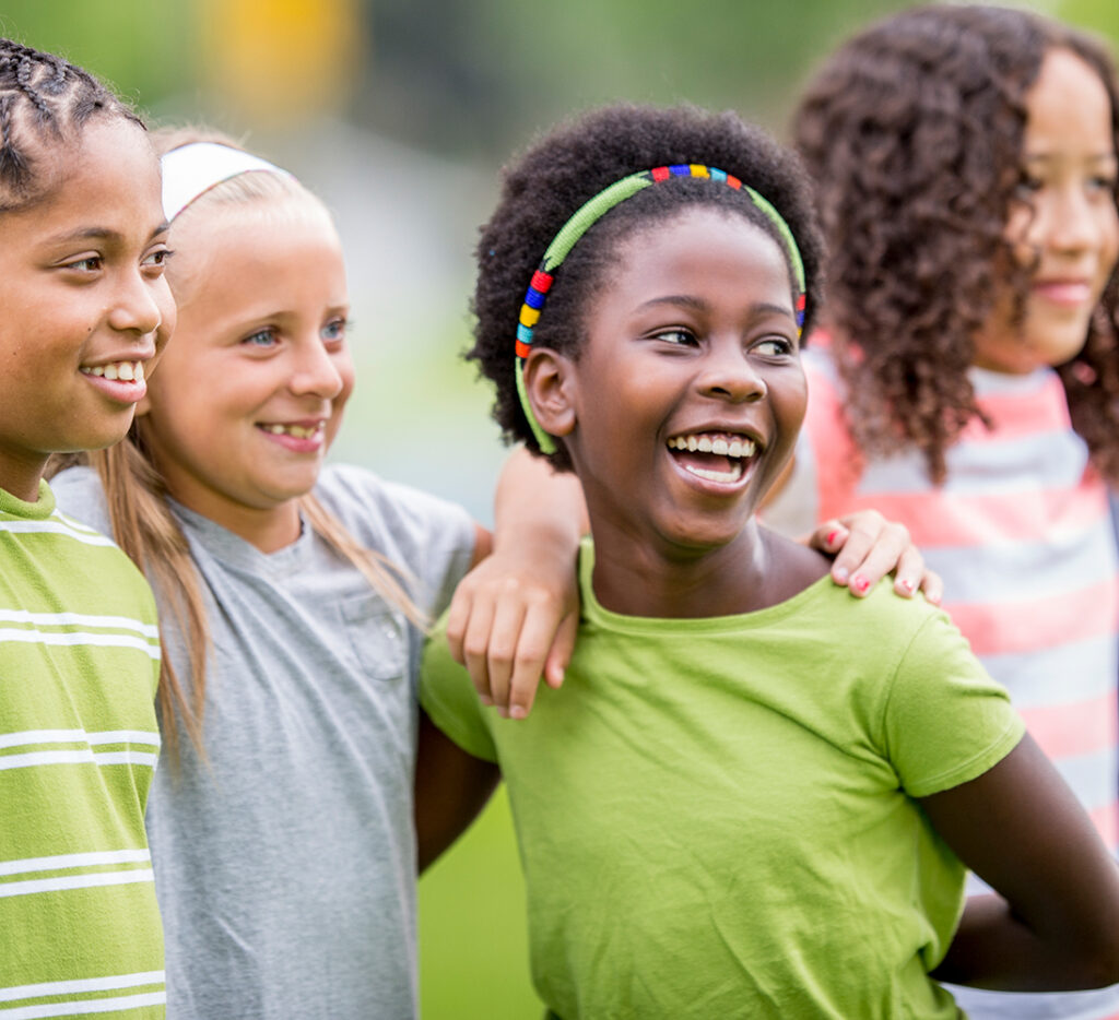 group of middle school girls hanging out outdoors at school